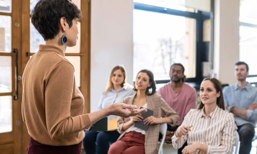 Woman training a group of managers