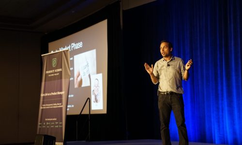man presenting on a stage